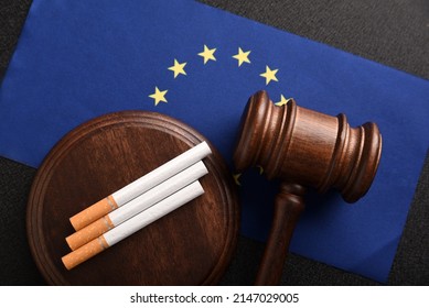 Flag of European Union, cigarettes and Judge gavel. Tobacco law. Smoking control in EU countries - Shutterstock ID 2147029005