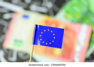 Flag Of The European Union EU And Euro Banknotes In The Background