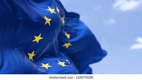 The flag of The European Union flapping in the wind. Economic and finance Community. Politics and Economy. Transnational political government - Shutterstock ID 2100770338