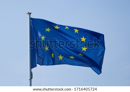 Flag of the European Union isolated on a clear blue sky waving on the wind 商業照片 © 