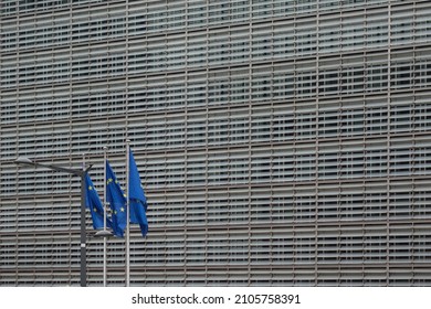 The Flag Of The European Union On The Background Of The Building Of The European Parliament In Brussels Belgium