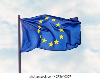 Flag of European Union over blue sky background