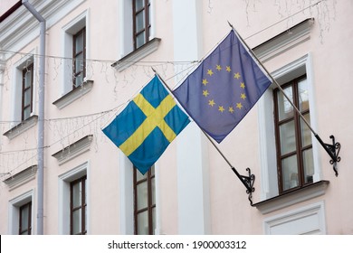 The Flag Of The European Union And Sweden On The Wall Of The Embassy Building.