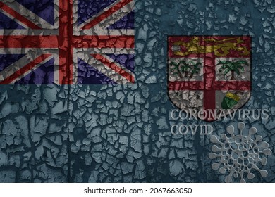 Flag Of Fiji On A Old Vintage Metal Rusty Cracked Wall With Text Coronavirus, Covid, And Virus Picture.