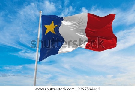 flag of French ancestry Acadians at cloudy sky background, panoramic view. flag representing extinct country,ethnic group or culture, regional authorities. copy space. 3d illustration