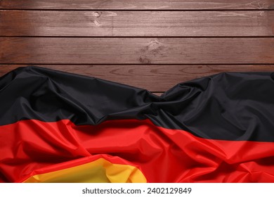 Flag of Germany on wooden background, top view. Space for text - Powered by Shutterstock