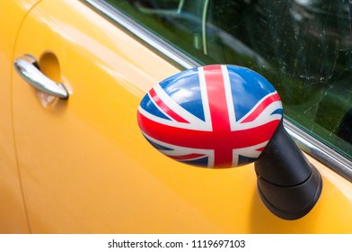 Flag Of The Great Britain Shown On Yellow Car Mirror. Concept Of British Patriotism.