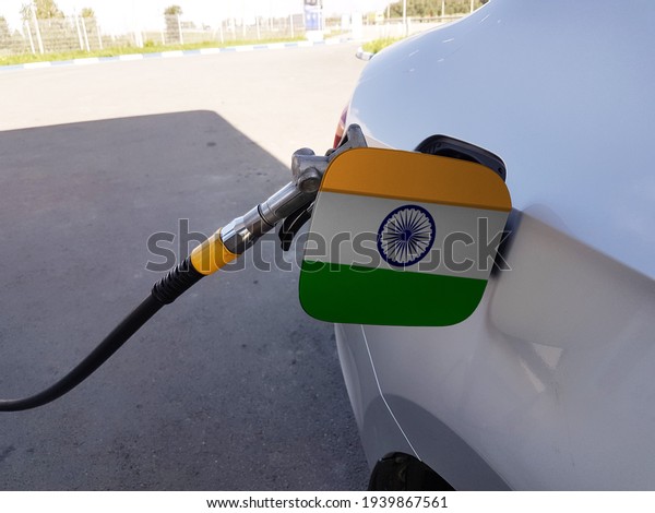 Flag of India on the car\'s\
fuel tank filler flap. Petrol station. Fueling car at a gas\
station.