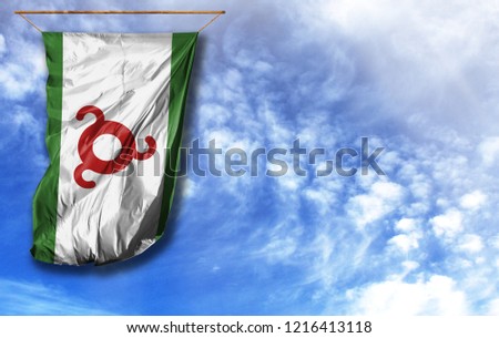 Flag of Ingushetia. Vertical flag, against blue sky with place for your text