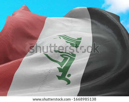 Flag of Iraq on Flag Pole in Blue Sky. Iraq Flag for advertising, celebration, achievement, festival, election. The symbol of the state on wavy cotton fabric.