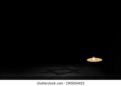 Flag of Israel, burning candles on a black background. Holocaust Memorial Day.Place for the label