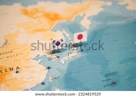The Flag of Korea and Japan on the World Map.