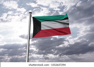 Flag of Kuwait waving in the blue sky. National Kuwait Flag on Pole.