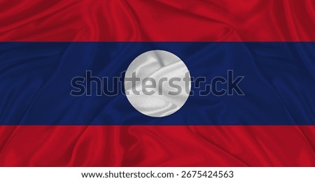Flag of Laos with cloth texture. Close up of Laos flag waving