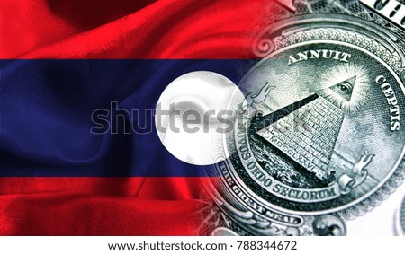 Flag of Laos on a fabric with an American dollar close-up.