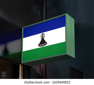 Flag Of Lesotho On On Signage Board Or Shop Sign. Lesotho Flag For Advertising, Award, Achievement, Festival, Election.