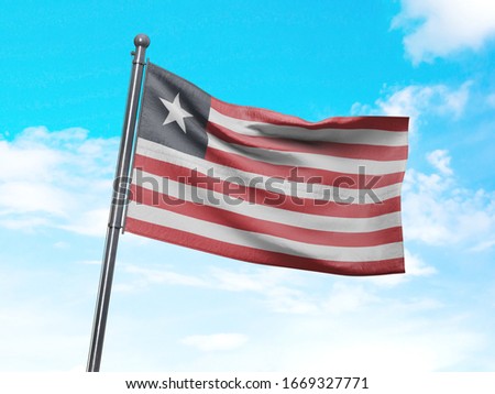 Flag of Liberia on Flag Pole in Blue Sky. Liberia Flag for advertising, celebration, achievement, festival, election. The symbol of the state on wavy cotton fabric.