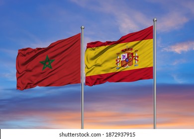 Flag Of Morocco And Spain Over A Sky Background