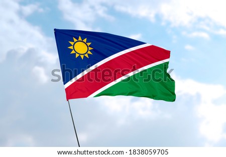 Flag of Namibia in front of blue sky