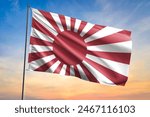 Flag of Naval Ensign of Japan waving flag on sunset view