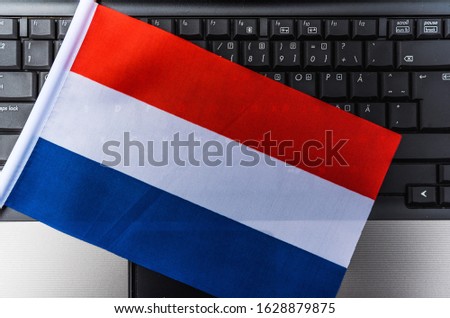 flag of Netherlands on computer, laptop keyboard