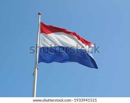 the flag of netherlands on a windy day