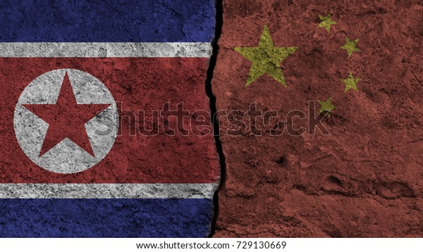 flag of the North korea and China painted on wall\
divided with crack , conflict / relations of North korea and China\
, war concept