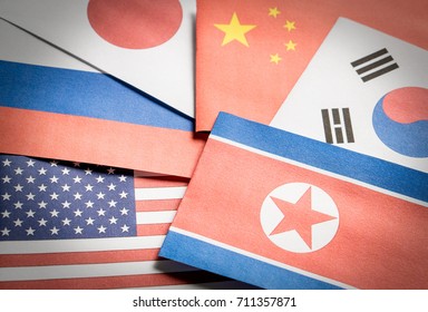 The Flag Of North Korea, South Korea, United Stated Of America (USA), Russia, Japan And China Made From Paper.