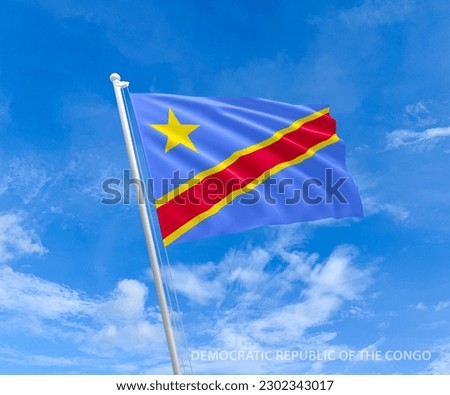 Flag on Democratic Congo flag pole and blue sky, Flag of  Democratic Congo fluttering in blue sky big national symbol. Waving red, yellow and cyan Democratic Congo  flag, Independence Constitution