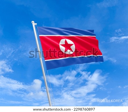 Flag on North-Korea flag pole and blue sky, Flag of North-Korea fluttering in blue sky big national symbol. Waving white blue  and red star North-Korea flag, Independence Constitution Day.