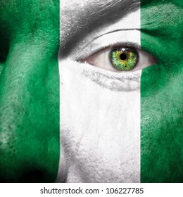 Flag Painted On Face With Green Eye To Show Nigeria Support