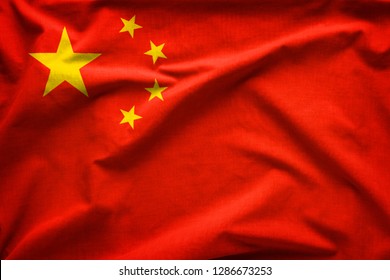 Flag Of The Peoples Republic Of China Or Five-Starred Red Flag Representing The Communist Party In A Close Up Full Frame Textured View