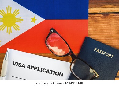 Flag of Philippines , visa application form and passport on table