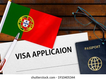 Flag of Portugal, visa application form and passport on table