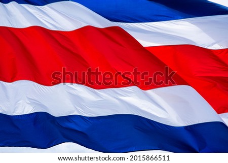 Flag of the Republic of Costa Rica waving in strong winds 
