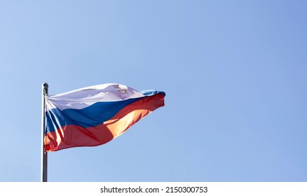 The flag of Russia against the background of a clear sky on the street no people place for text copy space mocap. Place for your text, copy space. Concept: stop hating Russians. Peace and prosperity 