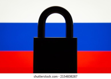 Flag of Russia with black lock in the foreground. Closed country, international isolation concept