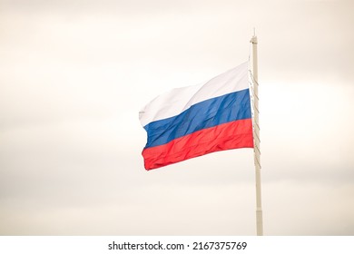 Flag of Russia on the background of a clear sky on the street. Place for copy space text mocap. Place for your text, copy space. Concept: peace and prosperity