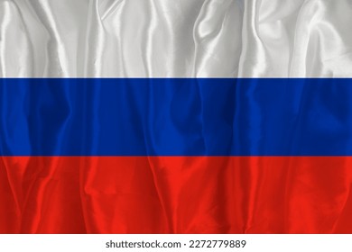 La bandera de Rusia en un fondo de seda es un gran símbolo nacional. Textura de las telas El símbolo oficial del país