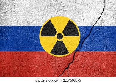 Flag Of Russia Painted On A Concrete Wall With Nuclear Weapon Sign. Russian Military Aggression