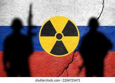 Flag Of Russia Painted On A Concrete Wall With Nuclear Weapon Sign. Russian Military Aggression