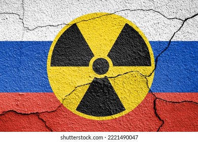 Flag Of Russia Painted On A Concrete Wall With Nuclear Weapon Sign. Russian Military Aggression