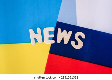 The Flag Of Russia And The Flag Of Ukraine Crossed With Each Other, News Inscription. The Concept Of News In Ukraine And Russia.