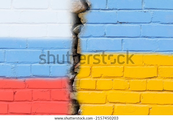 The flag of Russia and Ukraine on a\
brick wall with a cracked one. Ukraine-Russia politics, economy,\
relations, conflicts, war, peace, truce.\
Friendship.