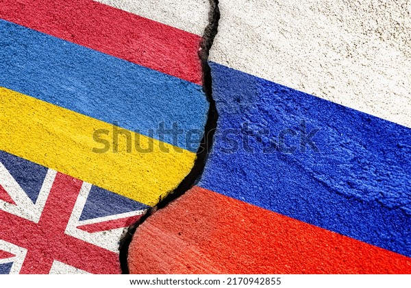 Flag of Russia\
and Ukraine, Poland, Great Britain on a cracked stucco wall as a\
concept of conflict and\
support