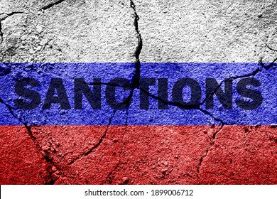 The flag of the Russian Federation on a cracked concrete wall with the words "SANCTIONS". Concept of sanctions against Russia. - Shutterstock ID 1899006712
