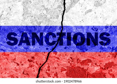 The flag of the Russian Federation on a cracked concrete wall with the words "SANCTIONS". Concept of sanctions against Russia. - Shutterstock ID 1902478966
