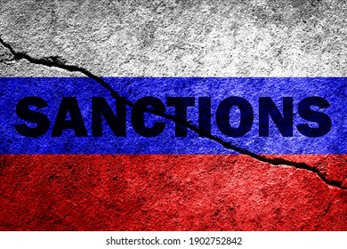 The flag of the Russian Federation on a cracked concrete wall with the words "SANCTIONS". Concept of sanctions against Russia. - Shutterstock ID 1902752842