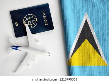 Flag of Saint Lucia with passport and toy airplane. Flight travel concept  - Shutterstock ID 2215790363