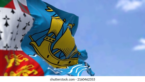 The Flag Of Saint Pierre And Miquelon Waving In The Wind On A Clear Day. Saint Pierre And Miquelon Is A Self-governing Territorial Overseas Collectivity Of France